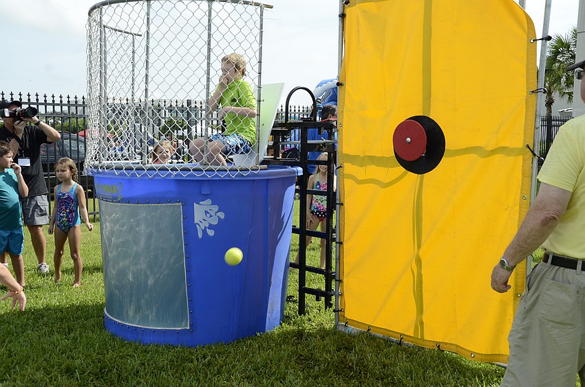 Adam Harrell, 12, gets dropped into the dunk tank.