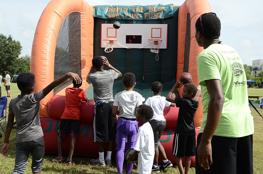 Children take their best shot at a basketball game.