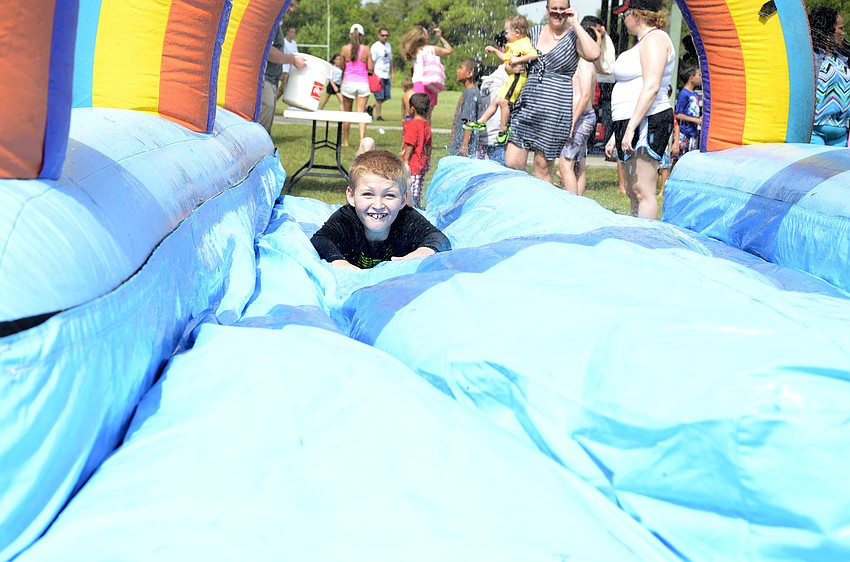 Cody McPherson, 11, shoots down the slip-n-slide.