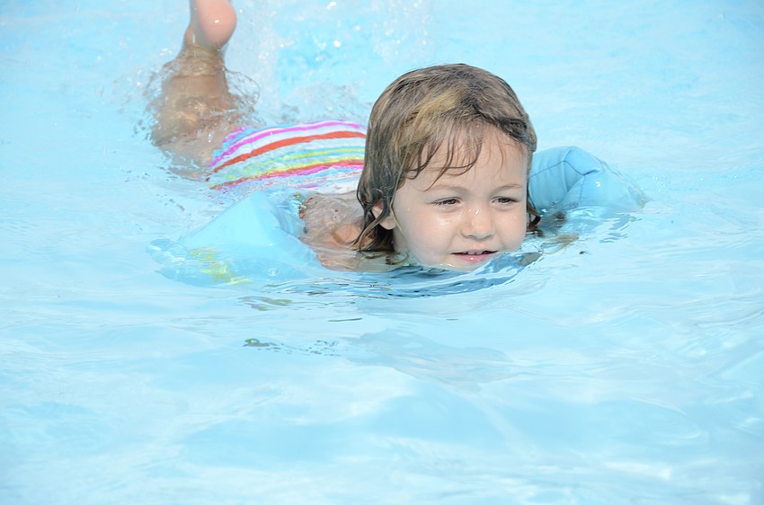 Ella Fuschetto, 3, tries to grab some toys during a treasure hunt.