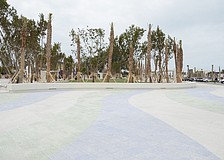 The east esplanade walkway is finished, featuring a blue, green and stone colored pattern.