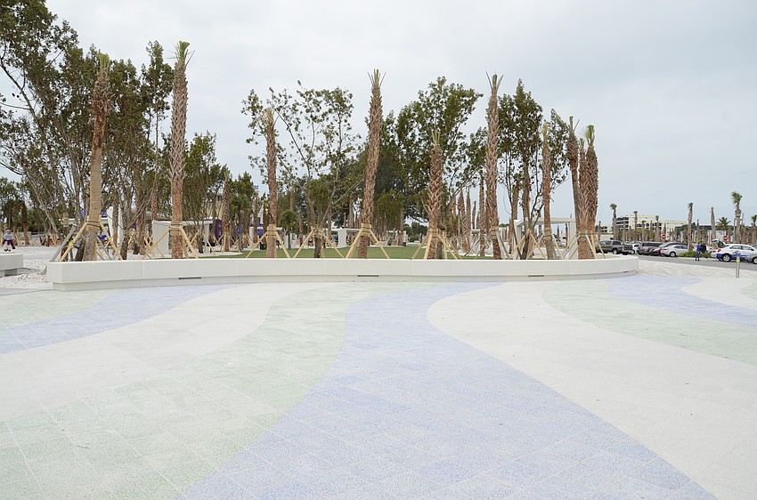The east esplanade walkway is finished, featuring a blue, green and stone colored pattern.