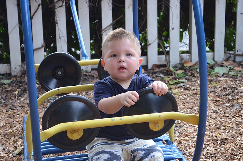 Abner Beck plays on the playground at the Temple Emanu-El Family Picnic.