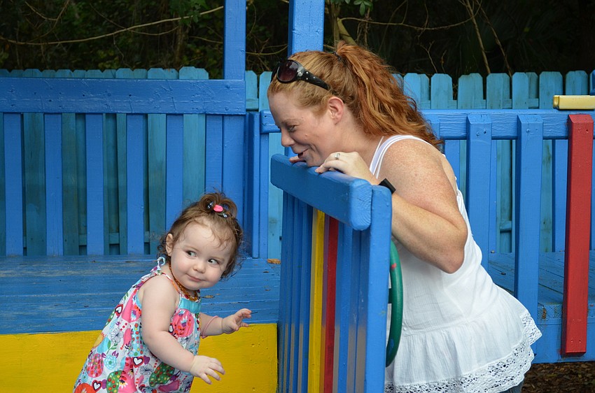 Sasha Leopold plays with her mother Alisha Leopold.
