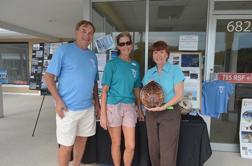 Jack Rozance and Cyndi Seamon, of the Longboat Key Turtle Watch, with chamber member Nancy Taussig, of Barefoot Weddings