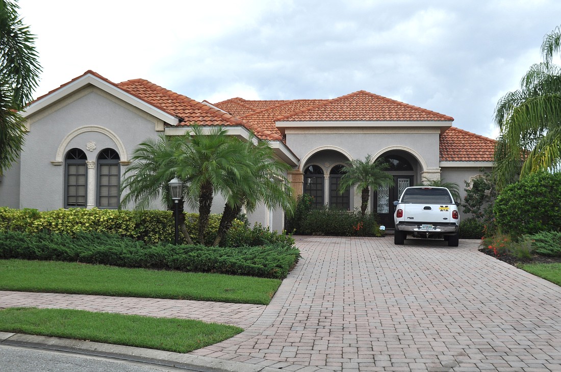 This home at 7518 Mizner Reserve Court has four bedrooms, three and a half baths, a pool and 3,577 square feet of living area.Â
