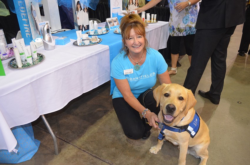 Karen Conkel, of Rodan & Fields, with Levi, a Southeastern Guide Dog in Training
