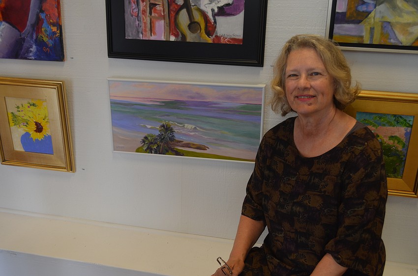 Artist Linda Nimmer with her piece, “Plein Aire from the 5th Floor of the Westchester,” which received an Honorable Mention