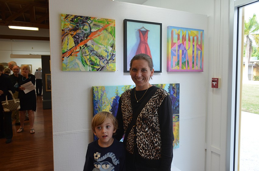 Emmett, 4, and artist Julie Kanapaux in front of her work,  “Within Reasonable Limits”