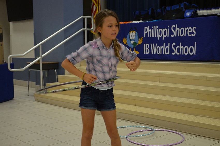 Brielle Lowenstein takes a turn with a hula hoop.