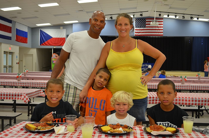 Victor and Rebecca Izquierdo enjoy a meal with their children Tyler, Casey, Cody and Tres.
