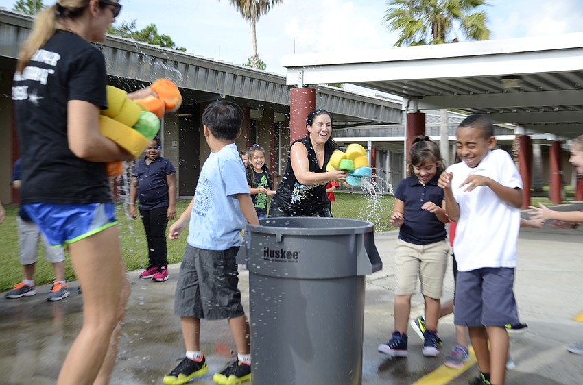 Assistant Principal Samantha Webb gets a little revenge while returning sponges to the water bins.