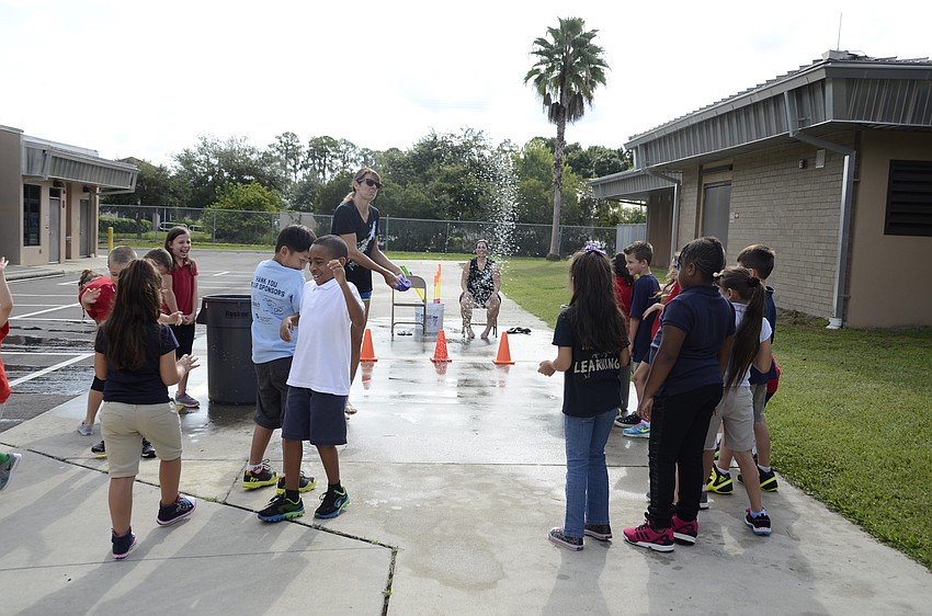 Principal Hayley Rio explains the sponge toss guidelines.