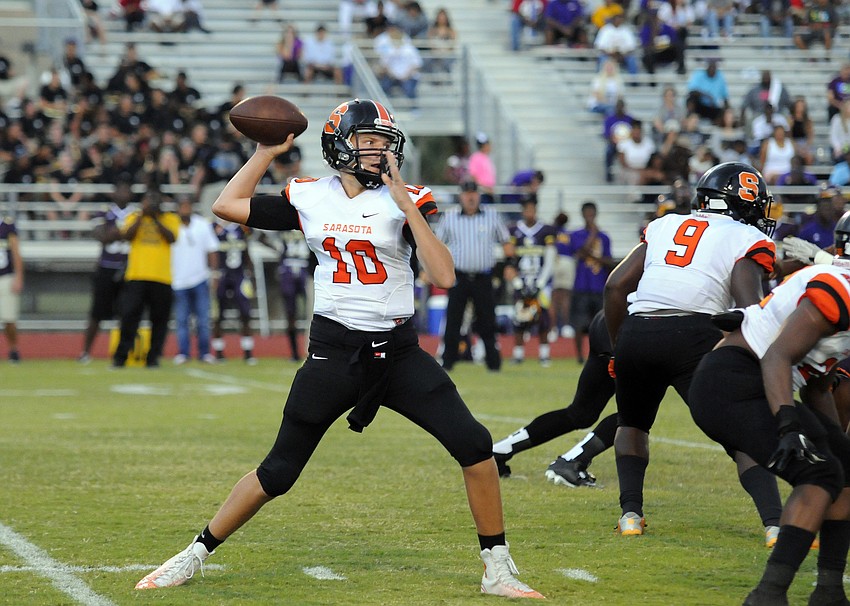Sarasota freshman quarterback Bryan Gagg drops back for a pass in the first quarter.