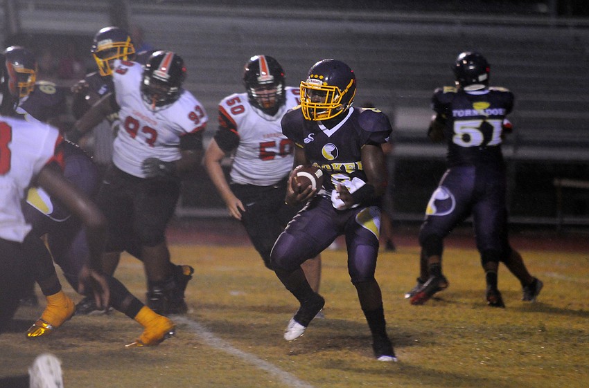 Booker senior Spencer Carter returns a punt in the first half.