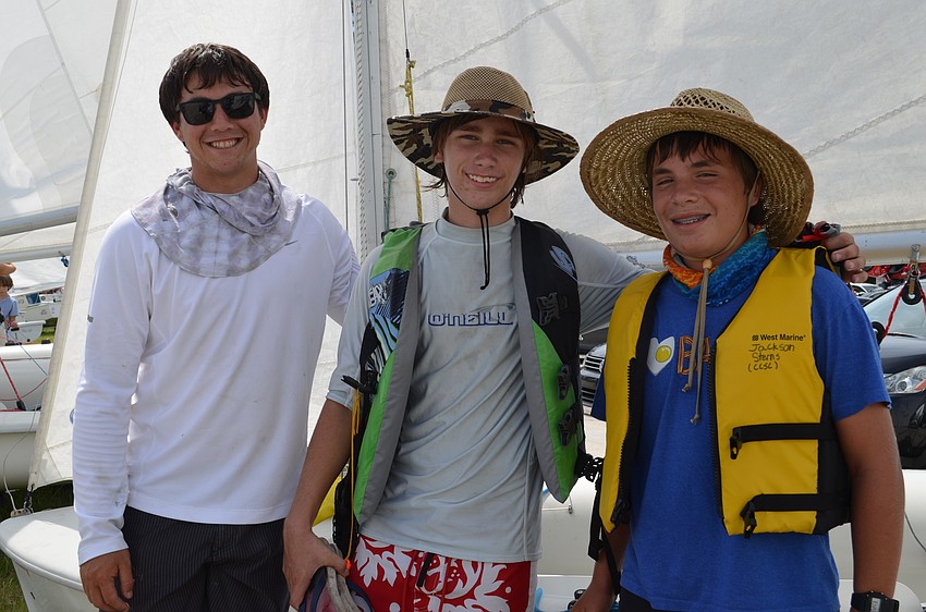 Coach Ian Simon with Christopher Stachewicz and Jackson Sterns.