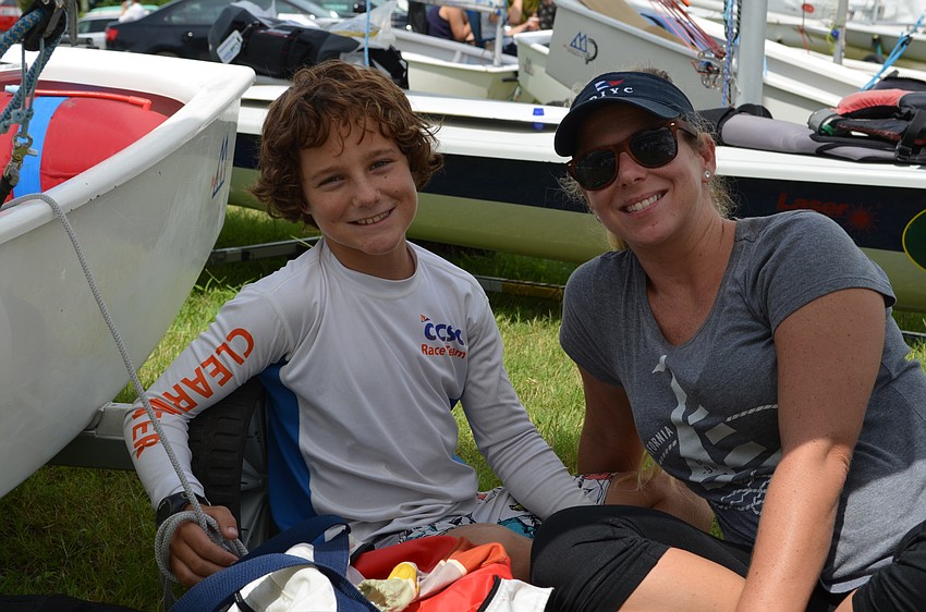 Maverick Putnam and his mother Heidi Putnam take a break in the shade.