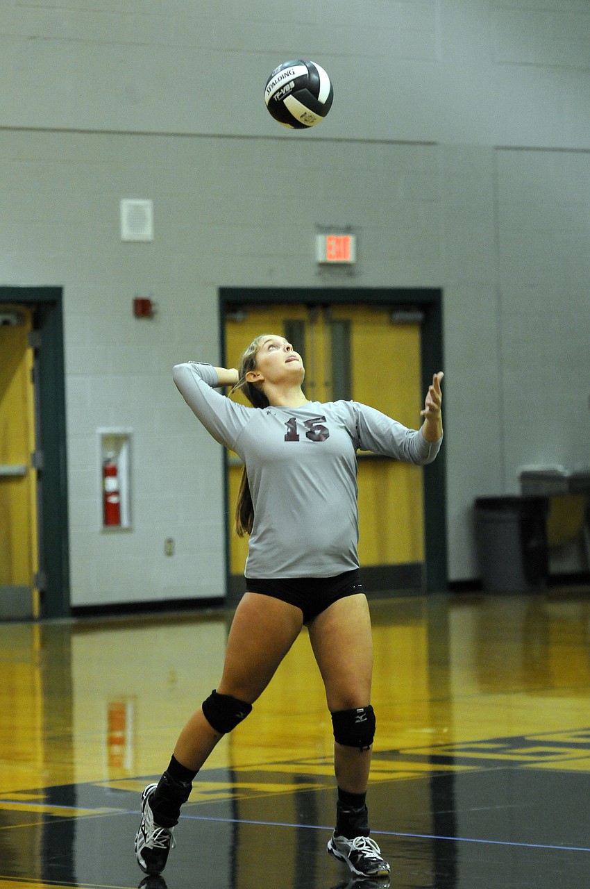 Sophomore Kayla Walker serves the ball during the first set.