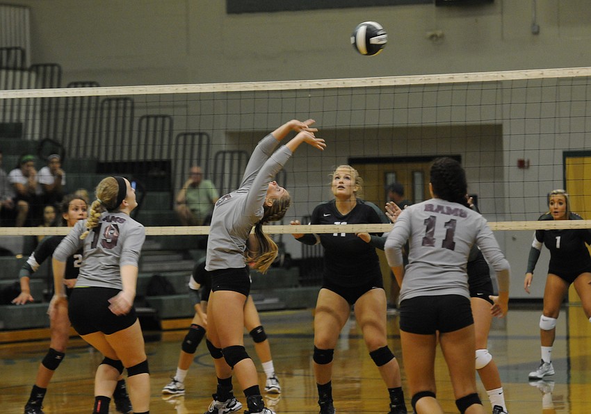 Setter Kayla Walker passes the ball back to a teammate.