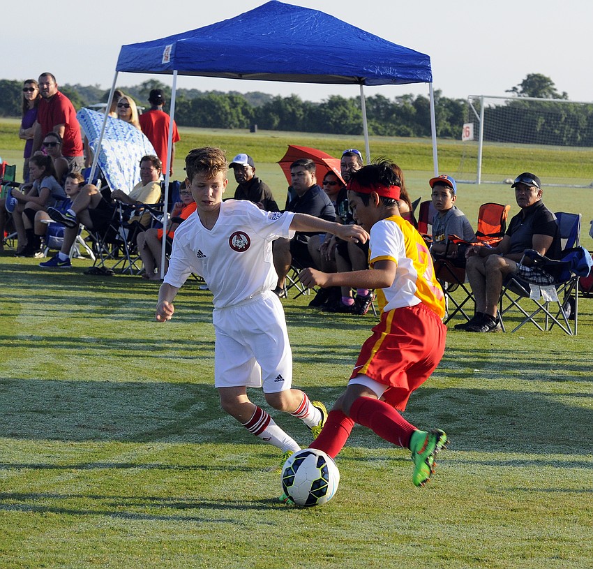 Marco Zagaceta attempts to maintain possession for the Lakewood Ranch Chargers.