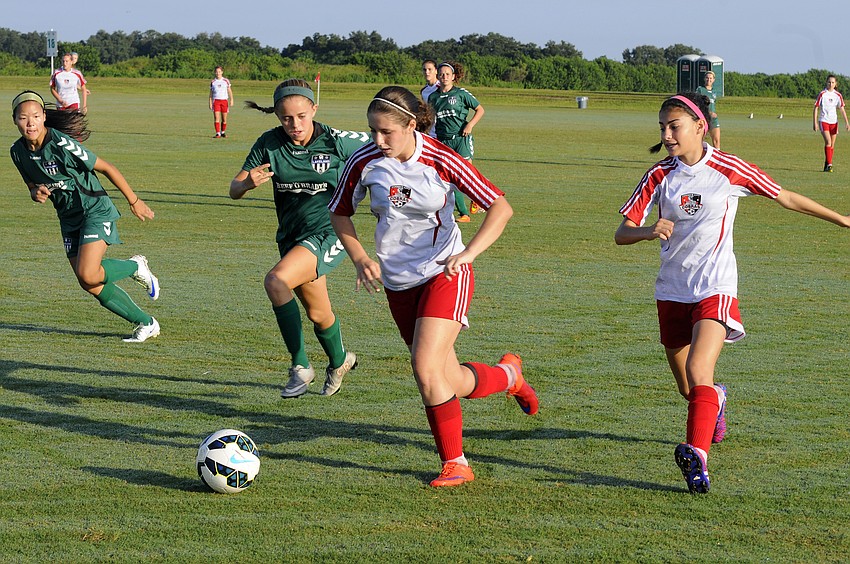 Danielle Gilchrist pushes the ball up the field for the Cooper City Optimist U15 girls team.