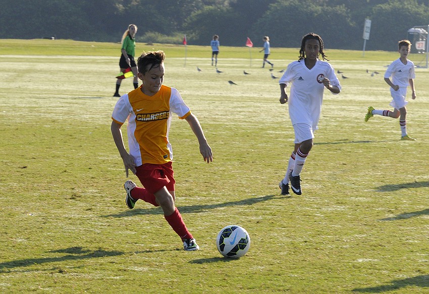 Eli Fizer pushes the ball down the field for the Lakewood Ranch Chargers.