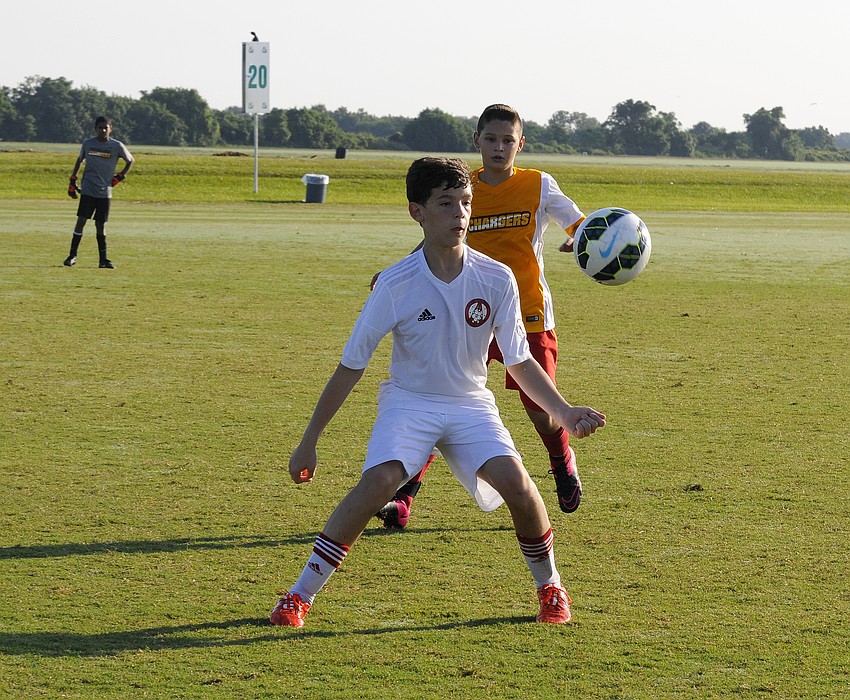 A Clay County midfielder attempts to regain possession.