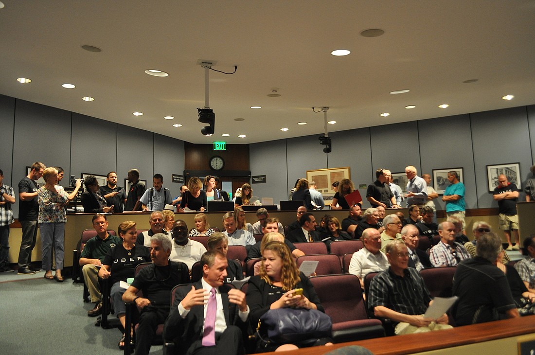 The chamber was packed with Uber supporters Tuesday, with the majority of the crowd cheering the city's actions.