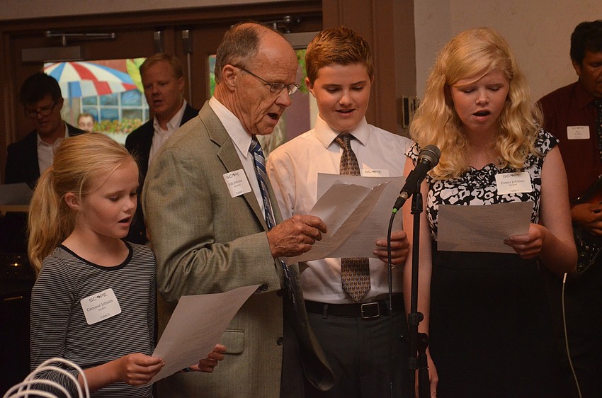 Bob Johnson sings along with his grandchildren.