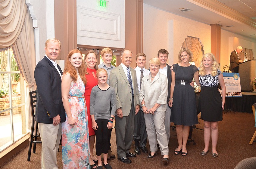 Carolyn Johnson, center, surrounded by her children and grandchildren.