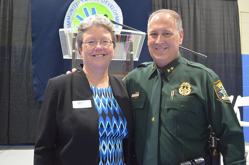 CYD Executive Director Karen Bogues with one of the 2015 Leadership Breakfast honorees Sheriff Tom Knight.