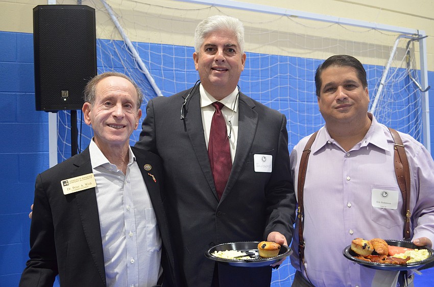 Sarasota Bradenton Airport Authority Commissioner Dr. Peter Wish, Rep. Julio Gonzalez and Eric Robinson.