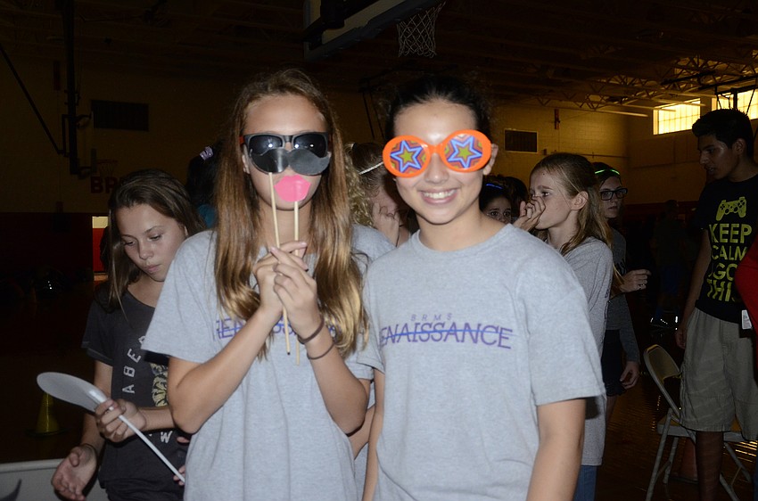Nicolette Woodruff and Emma Walther suit up for the Sarasota Fun Pix photo booth.