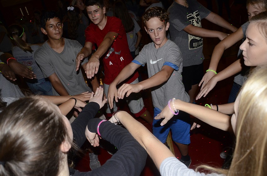 Some students chose to do the Macarena dance in a circle rather than the traditional row.