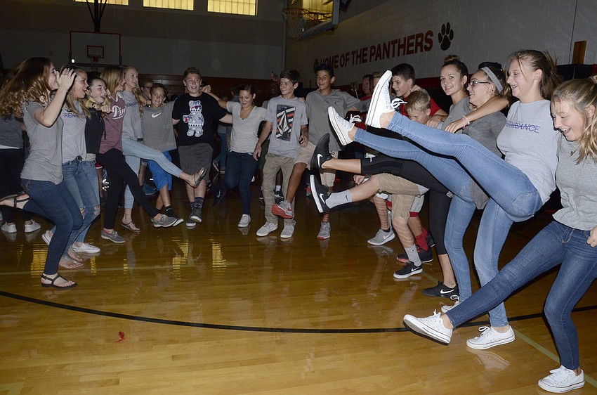 Braden River Middle students do a circle of A Chorus Line kicks.