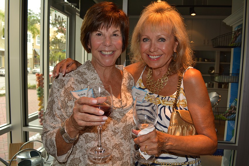 Ardell Terry, of the Ten Women Golfers women's giving circle, joins past Lakewood Ranch Community Fund president Diane Brune.