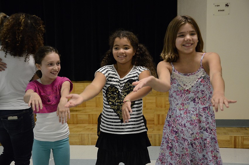 Jesse Fontana, Gabrielle Phillips and Lilly Torres do the Macarena.