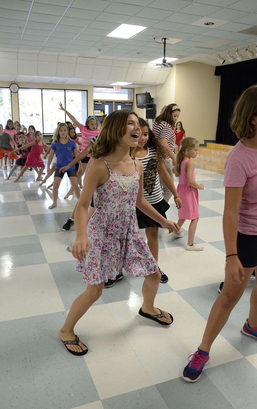 Lilly Torres does the Cupid Shuffle with her schoolmates.