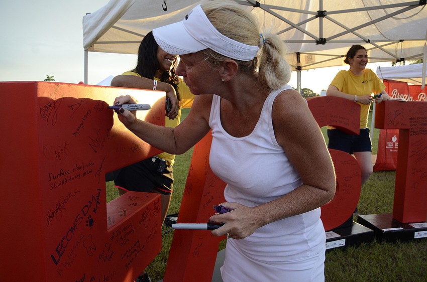 Leah Yoder signs the F in FAST, which is an acronym for the warning signs of a stroke.