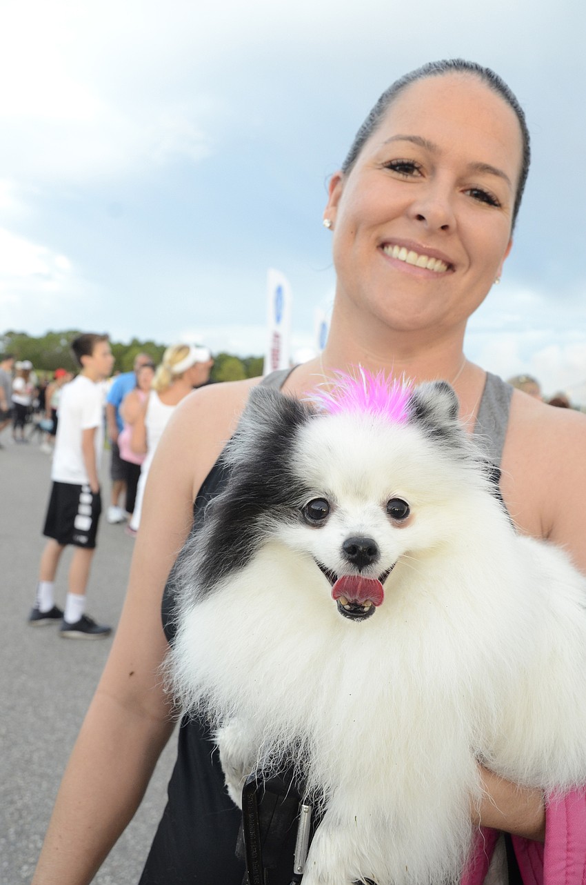 Angela Scheer and her pomeranian, Misha. Scheer said she had a little bag for Misha to rest in if she got tired during the walk.
