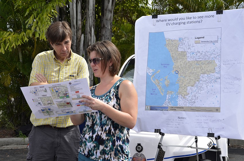 Raymond Kaiser and Stevie Freeman-Montes, Sustainability Manager with the city of Sarasota, discuss EV charging stations in the city. There are currently seven city-owned stations, but Montes said they'd gotten a lot of demand for more.