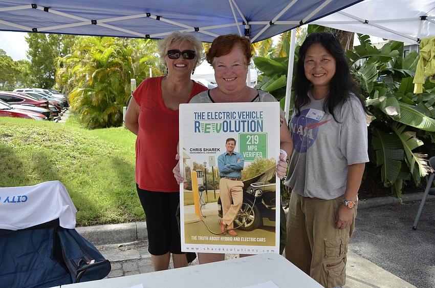 Renette Richard, Colleen Gray and Finn Perkins volunteered at the electric vehicle and sustainable energy expo.