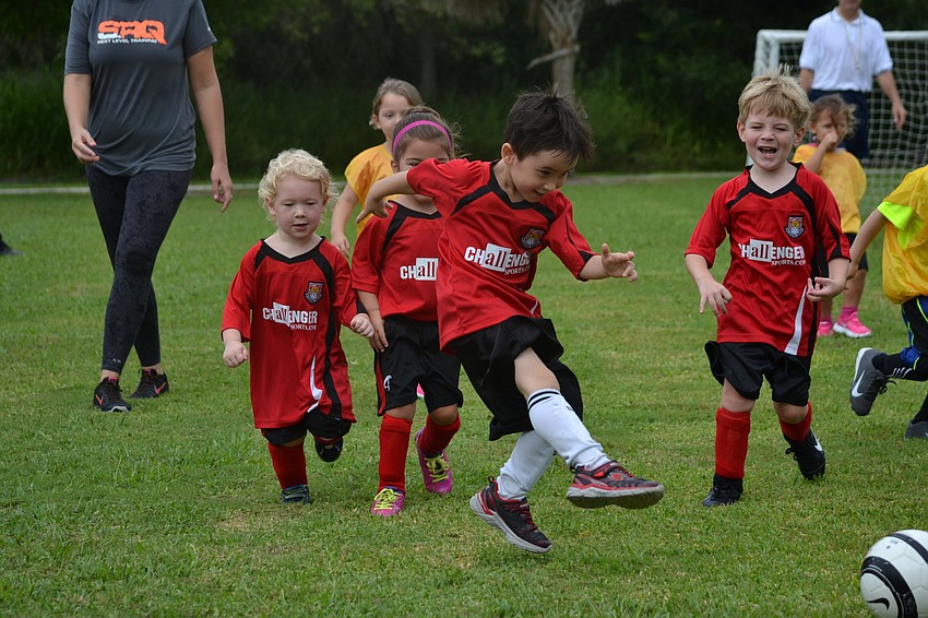 George Blagden kicks toward the goal.