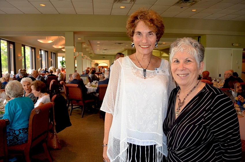 Alice Cotman and Sandy Schneiderman help coordinate the annual luncheon.
