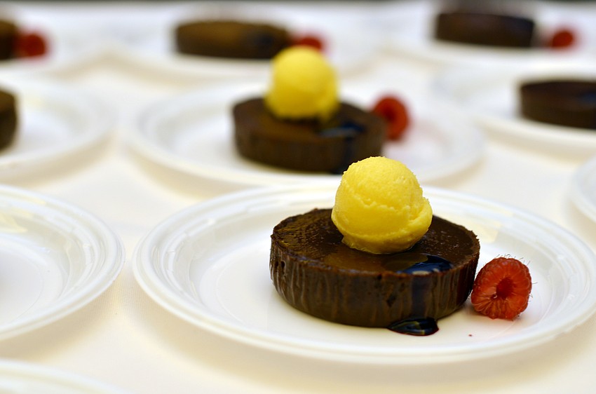 Mozaic’s Belgian dark chocolate Moelleux with passion fruit sorbet and black currant coulis