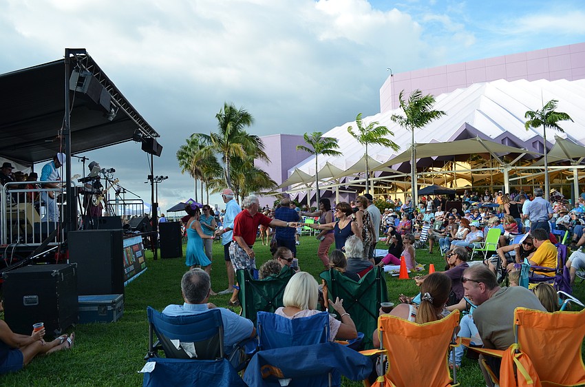 Fans set up lawn chairs and blankets for the free concert at the Van Wezel Performing Arts Hall Friday evening.