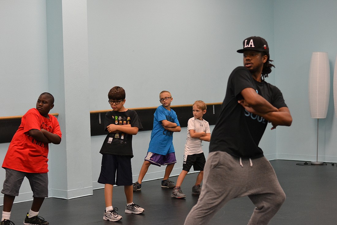 Kris Powell walks students through new choreography for his hip-hop class at Soul Studios.