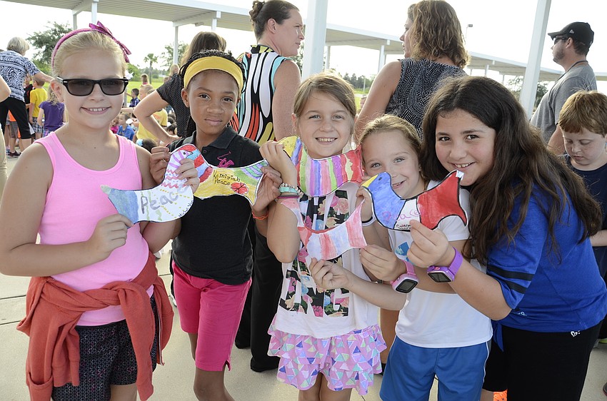 Michal McClusky, Kemijiah Keno, Brianne Bonzheinn and Caitlyn Salerno show off their peace doves.