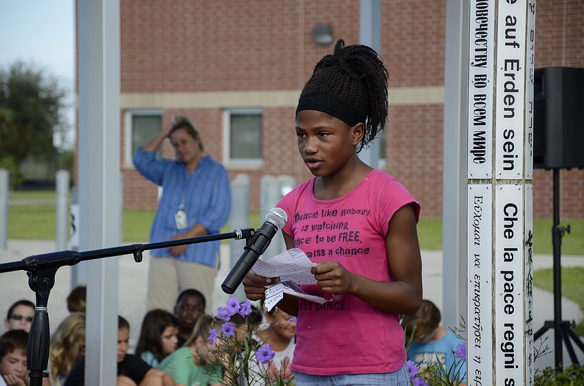 Fifth-grader Azareeyah Heaven speaks about the importance of peace during the assembly.