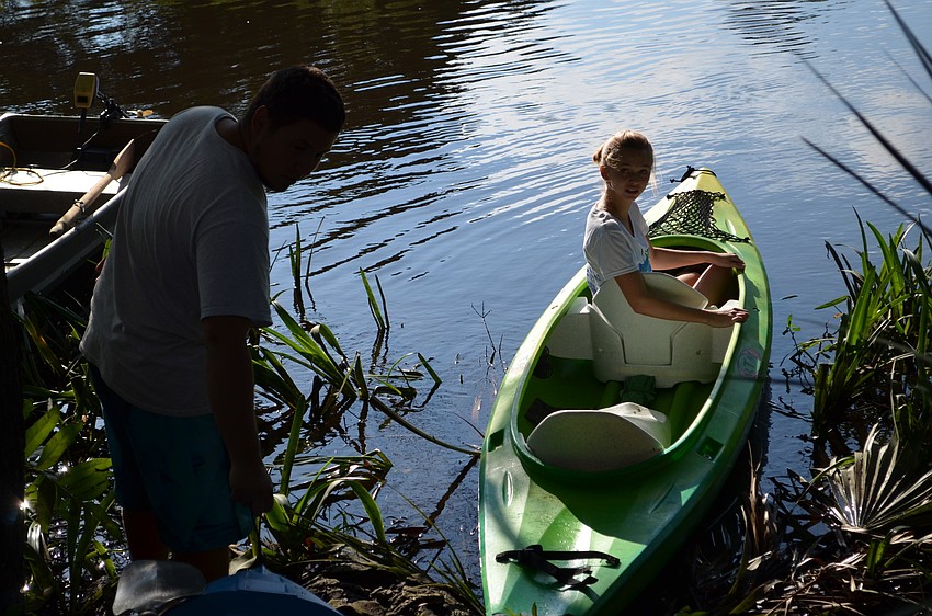 Kathleen Hagan prepares to launch on her kayak down Philippi Creek.